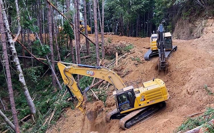 Heavy equipment operators with California State Park staff removing a segment of a defunct logging road in the Greater Mill Creek area within Redwood National and State Parks. Photo credit: CA State Parks Field Staff